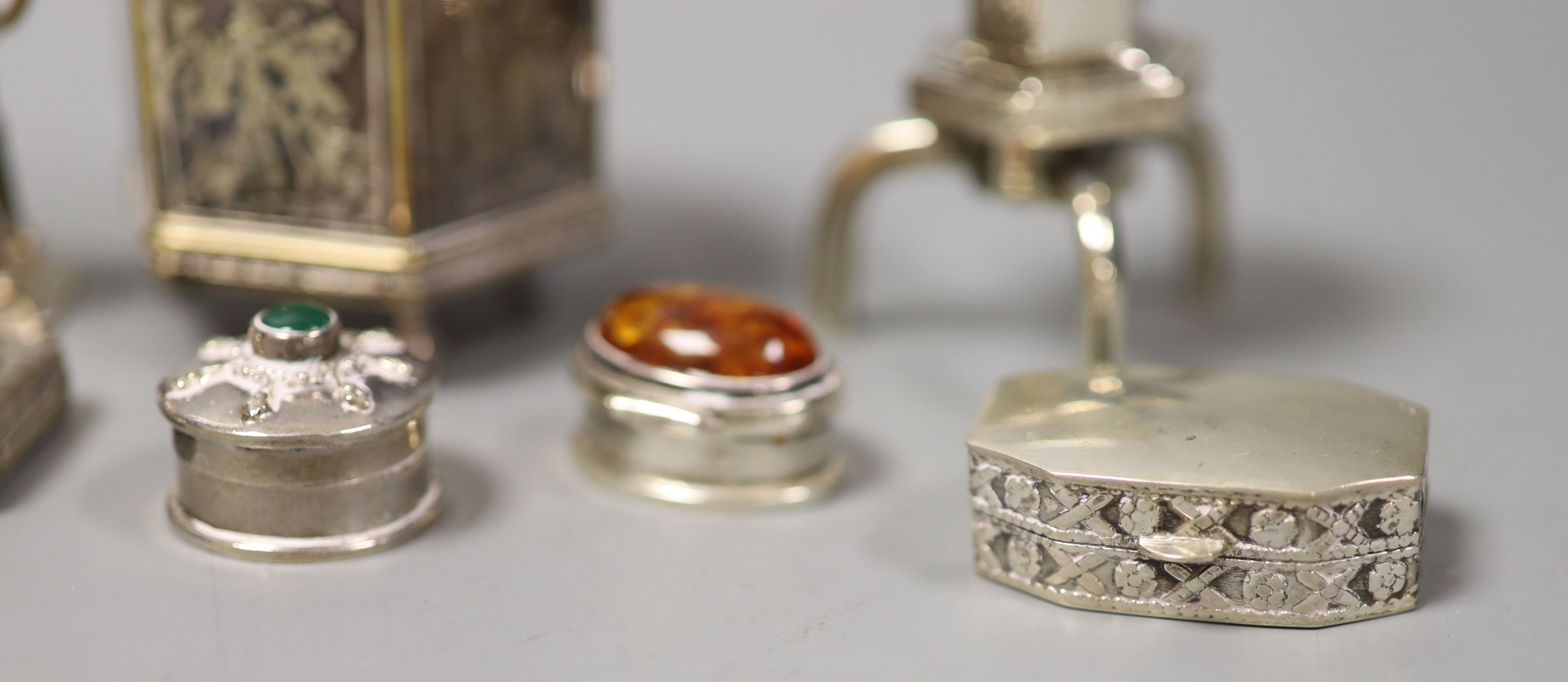 A collection of Chinese white metal and plated items, including six small boxes,